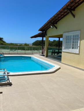 Casa beira rio-mar